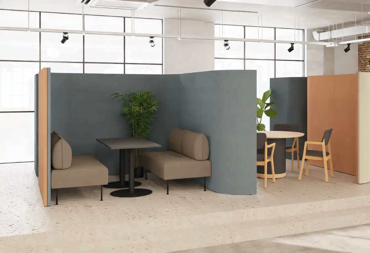 Curved acoustic partition screens creating meeting spaces