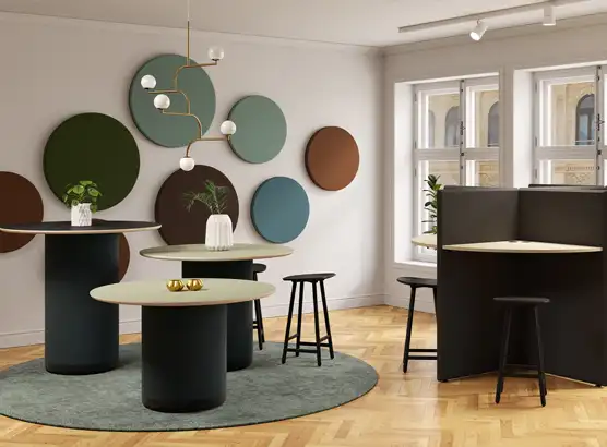 Acoustic round wall panels with bass trap tables and office screens 