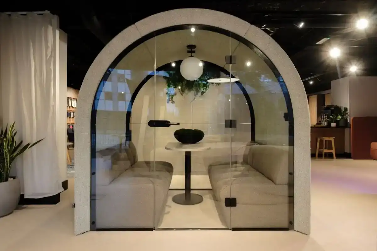 An arched office pod for quiet work and small meetings