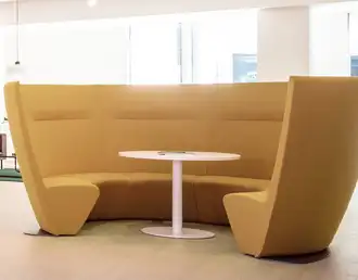 Atom modular high-back acoustic seating configured in a curved shape