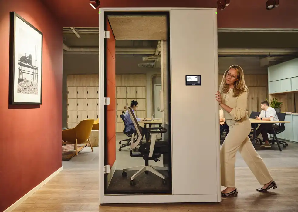 Calma pod being pushed on castors in an office.