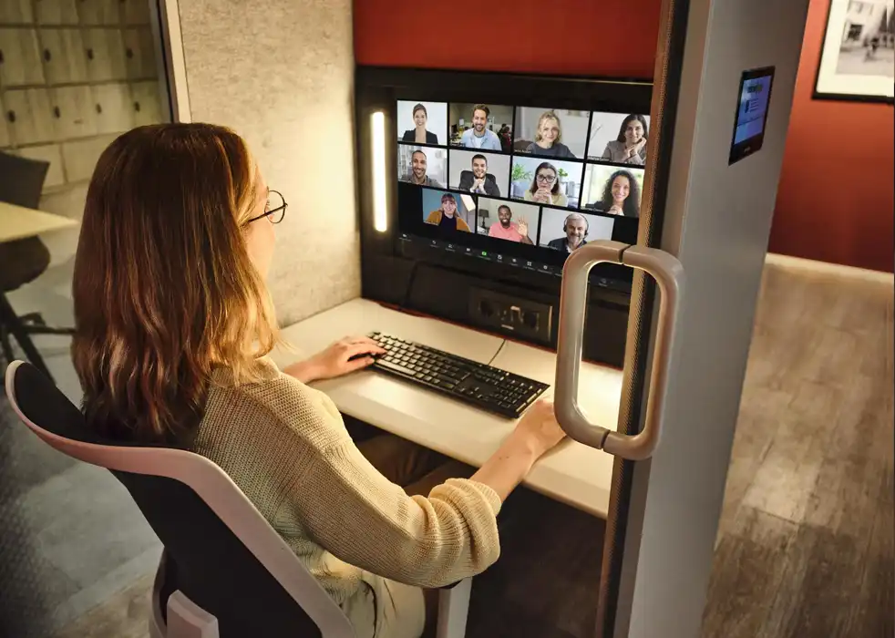 Calma pod being used for team video conferencing.