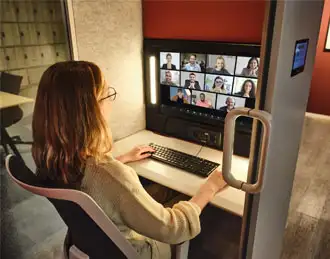 Calma Z pods Video conferencing office pod being used for a team meeting