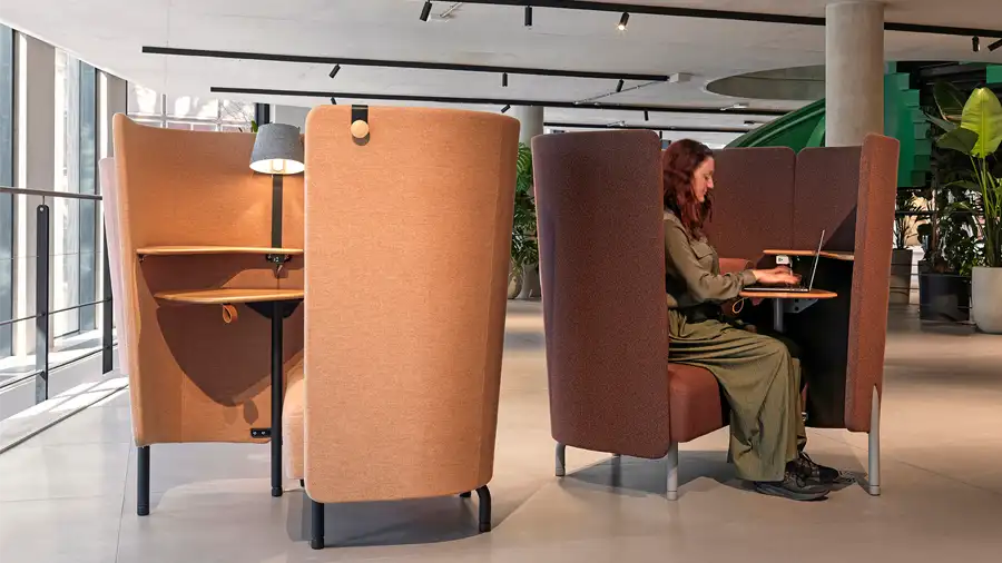 Upholstered privacy office booths with built-in swivel table & lamp