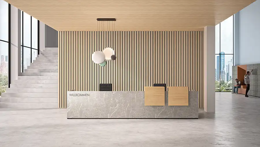 Modular Basic C reception desk featuring concrete laminate fascia and wood veneer counter uprights