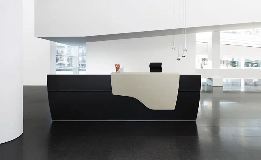 Black boat shaped reception counter with metal white counter in minimal office