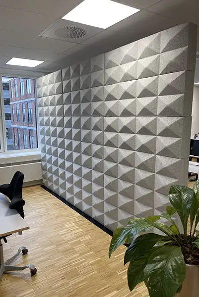 Fabricks acoustic wall with 3D bricks dividing an office