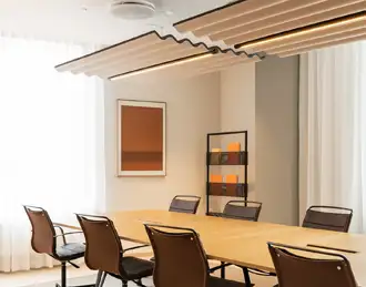 Scala acoustic ceiling canopies above a meeting room table