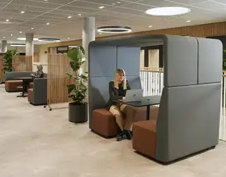 Modular horseshoe soft seating with acoustic roofed booth