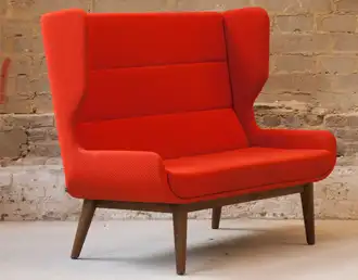 High-back acoustic sofa with side wings for increased user privacy