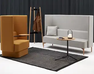 Acoustic privacy chair with rotating base and integrated tablet arm